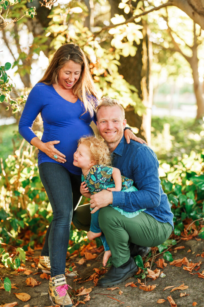 Family of three authentically happy outdoors